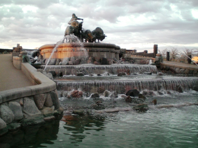 fountain topped with statue of figure driving bovines in Kastellet park, København