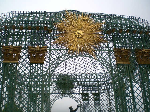 gold decorative sunburst on gazebo-like curved grill work, Sanssouci, Potsdam